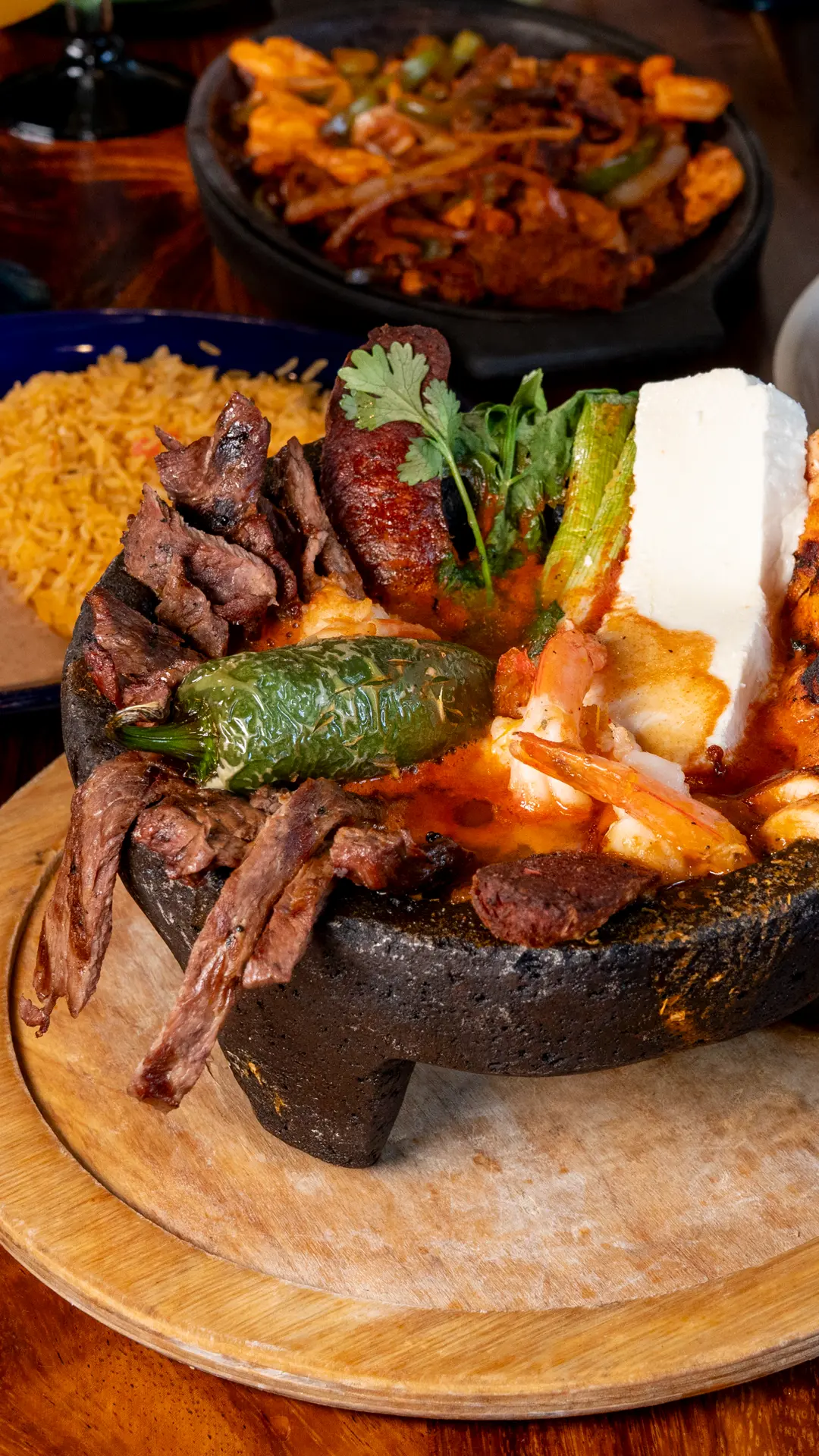 Molcajete with steak, shrimp, chorizo and queso